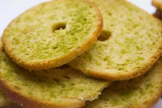 Healthy bruschettas baked with green herbs.