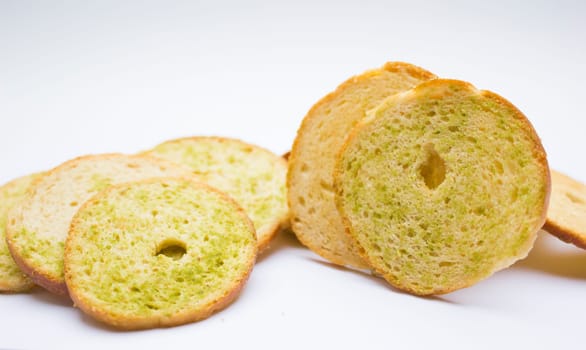 Healthy bruschettas baked with green herbs.
