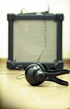 Headphones and guitar amplifier
