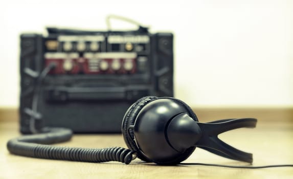 Headphones and guitar amplifier
