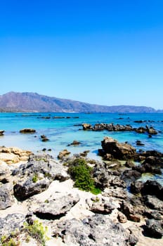 Elafonisi or Elafonissi, "deer island"" in Greek, is an island located close to the southwestern corner of the Mediterranean island of Crete, Greece. Elafonisi is an oblong, which often ""breaks"" in two parts by water giving the impression of being a separate island. The island is a protected nature reserve."