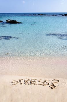 Word Stress written on sand, with a question mark,  relax concept