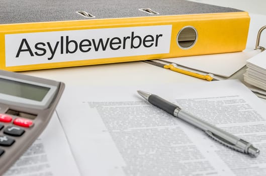 File folder labeled Asylum Seekers
