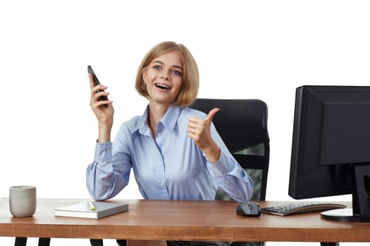 pretty blonde business woman using phone and showing thumbs up gesture in the office
