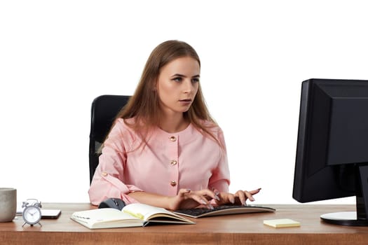 beautiful female manager using PC computer for online work at office