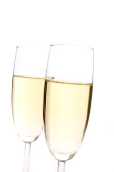 Two glasses of sparkling wine with a red bow