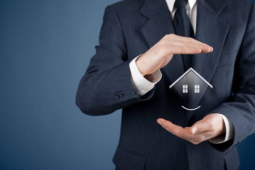 Property insurance, security and real estate agent concept. Protecting gesture of man and symbol of house..