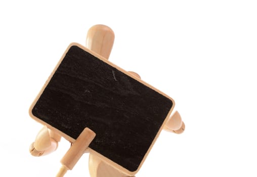 Wooden man holding a blackboard with space for text