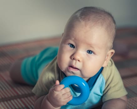 Cute beautiful baby is playing toy