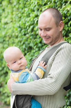 Baby and father outdoor portrait
