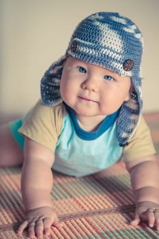Cute beautiful baby is wearing a funny hat