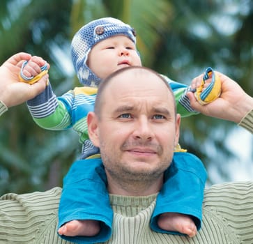 Baby and father outdoor portrait