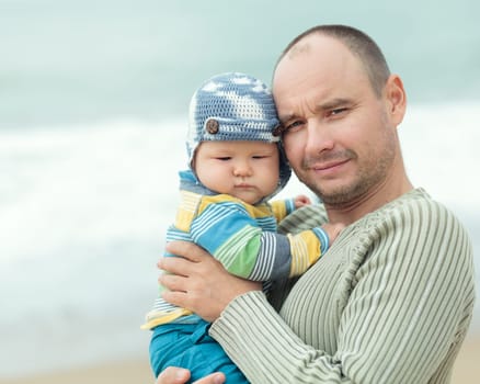 Baby and father outdoor portrait