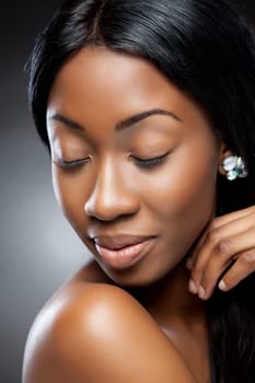 Perfect black beauty closeup on dark background