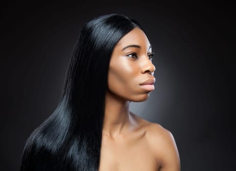 Beautiful young black woman with long straight hair
