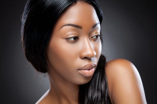 Perfect black beauty closeup on dark background