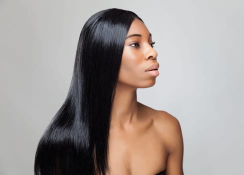 Beautiful young black woman with long straight hair