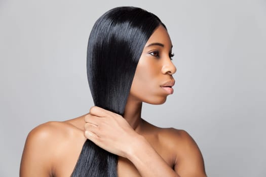 Beautiful young black woman with long straight hair
