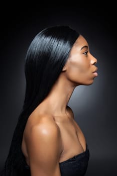 Beautiful young black woman with long straight hair
