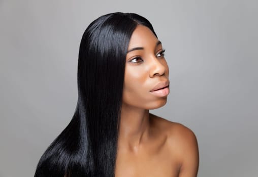 Beautiful young black woman with long straight hair
