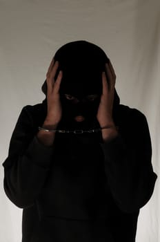 Black Dressed Young Man Trapped in Hancduffs