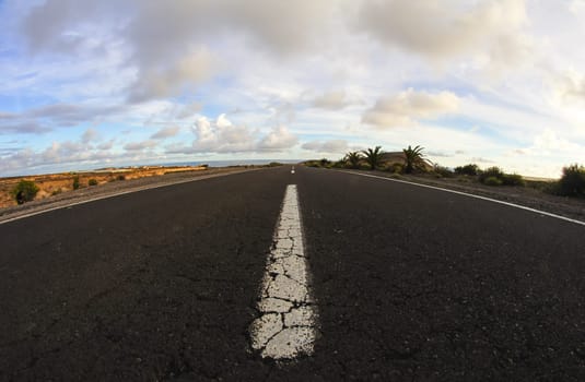Long Empty Desert Road on a Cludy Day
