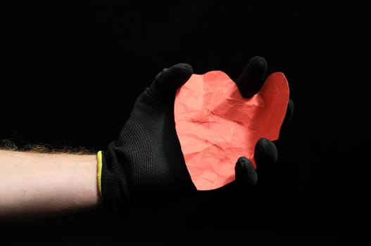 Heart And an Hand on a Black Background