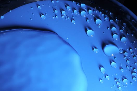 Some Water Drops on a Blue Textured Background