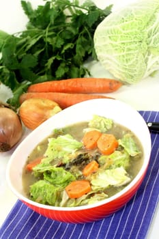a red bowl with savoy cabbage stew