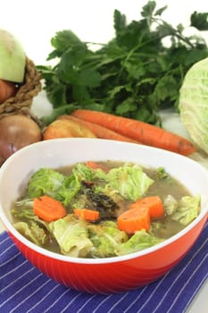 a red bowl with savoy cabbage stew