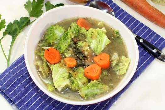 a red bowl with savoy cabbage stew