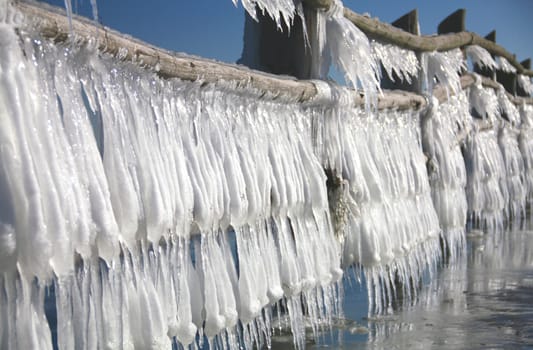 Icicles on a wooden fence on the Baltic Sea,Vorpommersche Boddenlandschaft National Park,Darss,near Prerow,Mecklenburg-Vorpommern,Germany