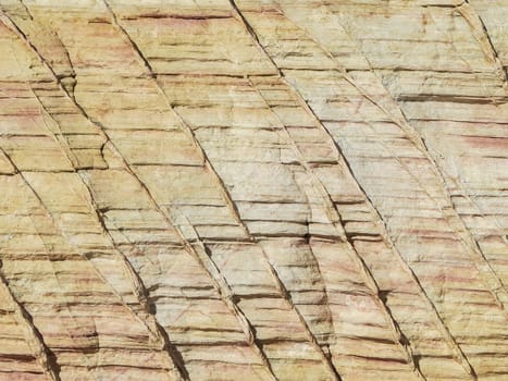 Strongly patterned light natural rock,light brown with red inclusions,format-filling.