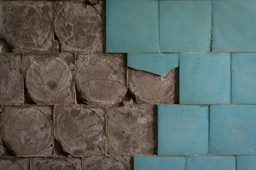old ceramic floor tiles falling off from the wall