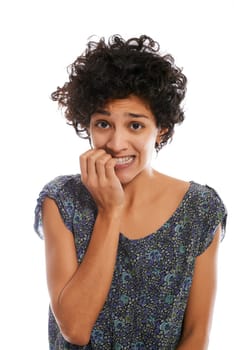 portrait of worried and stressed hispanic girl biting nails and looking at camera on white background