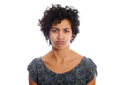 portrait of hispanic woman looking at camera upset and sad. Isolated on white background
