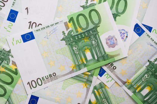 Many euro banknotes making european currency background