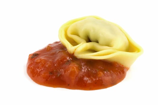Tortelloni with sugo,close-up of Italian pasta on a white background