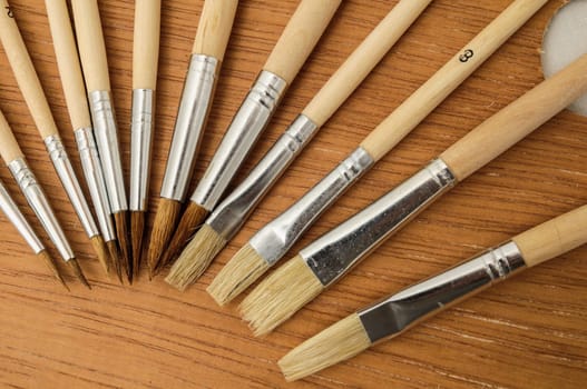 New Wooden Different Paintbrush Set Texture over a Colored Background