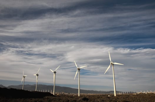 Eletric Power Generator Wind Turbine over a Cloudy Sky