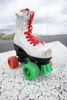 Old Vintage White Skate Boot on the Asphalt Sterret