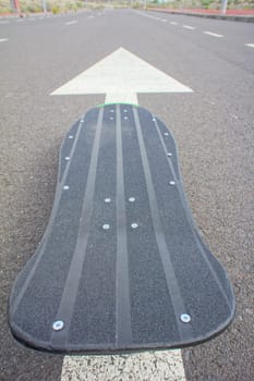 Hdr Picture Vintage Style Longboard Black Skateboard on an Empty Asphalt Desert Road