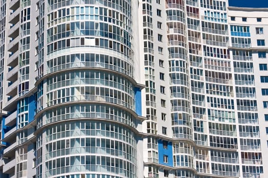 Beautiful view of modern apartment building under blue sky
