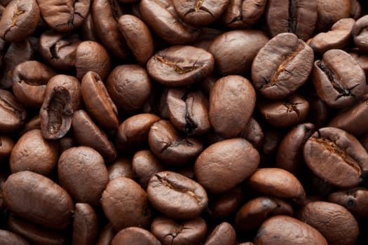 Close-up of brown coffee beans, background texture
