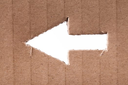 Arrow shape in cardboard with a white background