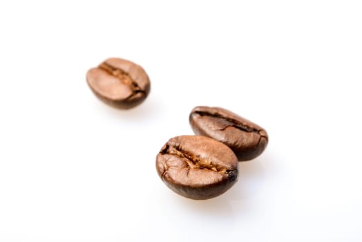 Macro photografy of coffee beans isolated on a white background