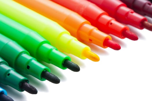 Group of felt tip bright color markers on white background