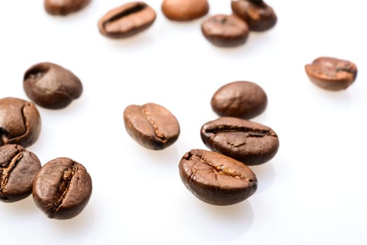 Macro photografy of coffee beans isolated on a white background