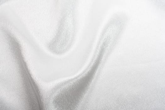 Abstract background white silk fabric with beautiful waves