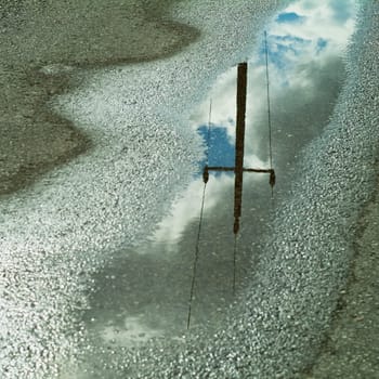 Power pylon reflected in paints
